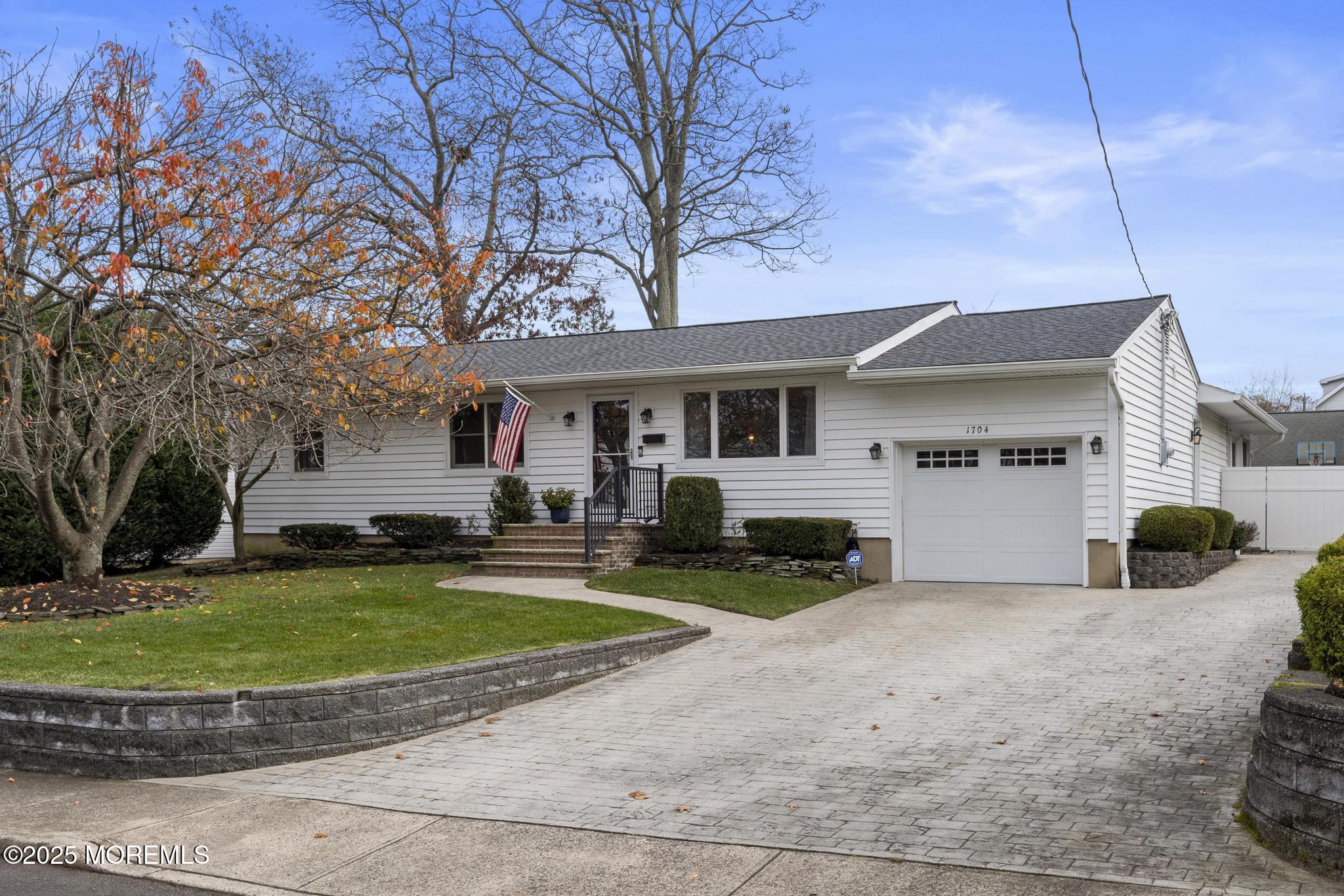 1704 Grove Street Wall, NJ 07719 - Photo 3 of 53 a view of a house with a yard and large tree