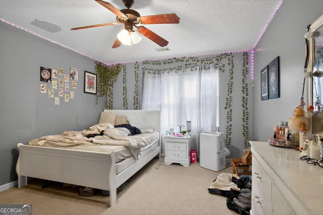 a bed room with a bed and a window