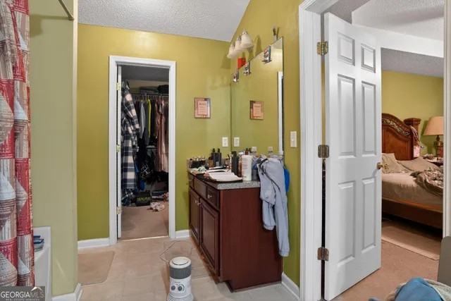 a view of a bedroom from a hallway