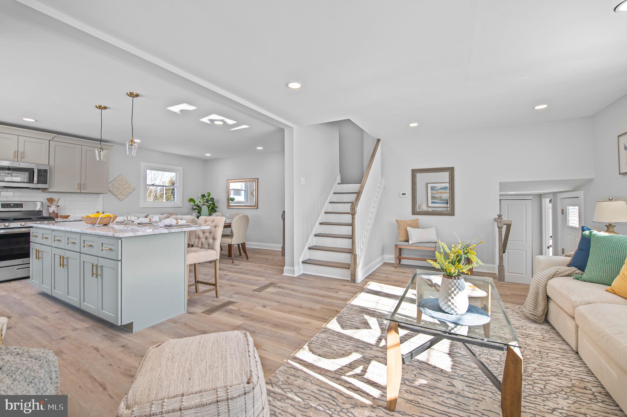 356 Abrams Mill Road King of Prussia, PA 19406 - Photo 16 of 46 a living room with furniture and kitchen view