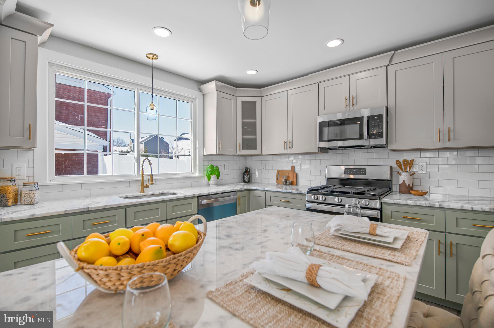 356 Abrams Mill Road King of Prussia, PA 19406 - Photo 2 of 46 a kitchen with stainless steel appliances a stove a sink and a microwave