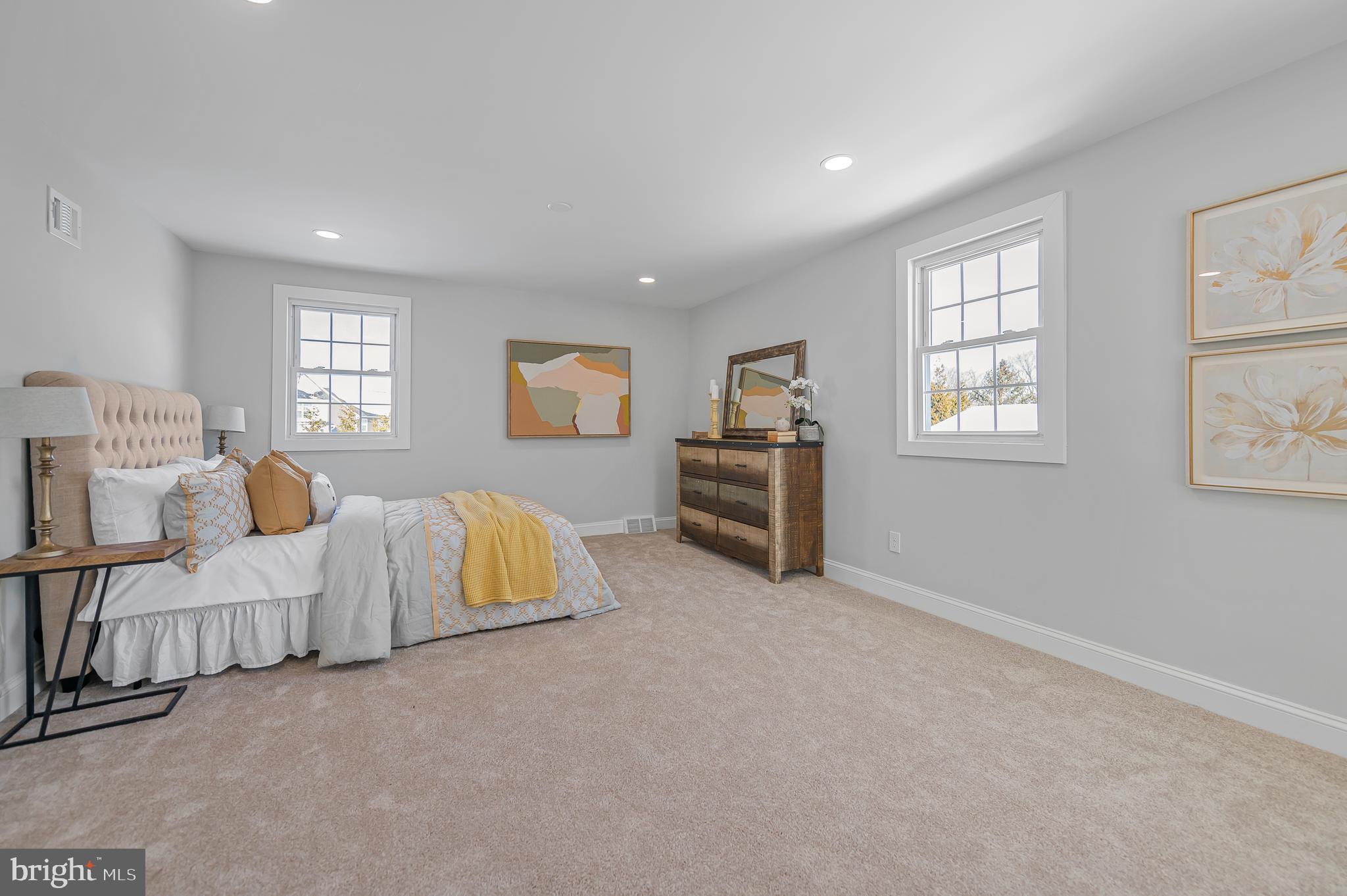 356 Abrams Mill Road King of Prussia, PA 19406 - Photo 27 of 46 a spacious bedroom with a bed and a couch