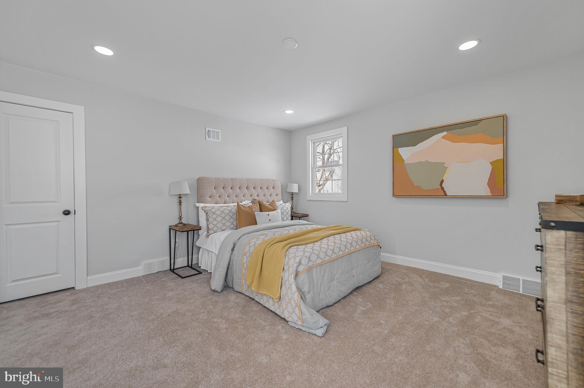 356 Abrams Mill Road King of Prussia, PA 19406 - Photo 28 of 46 a spacious bedroom with a bed and painting on the wall