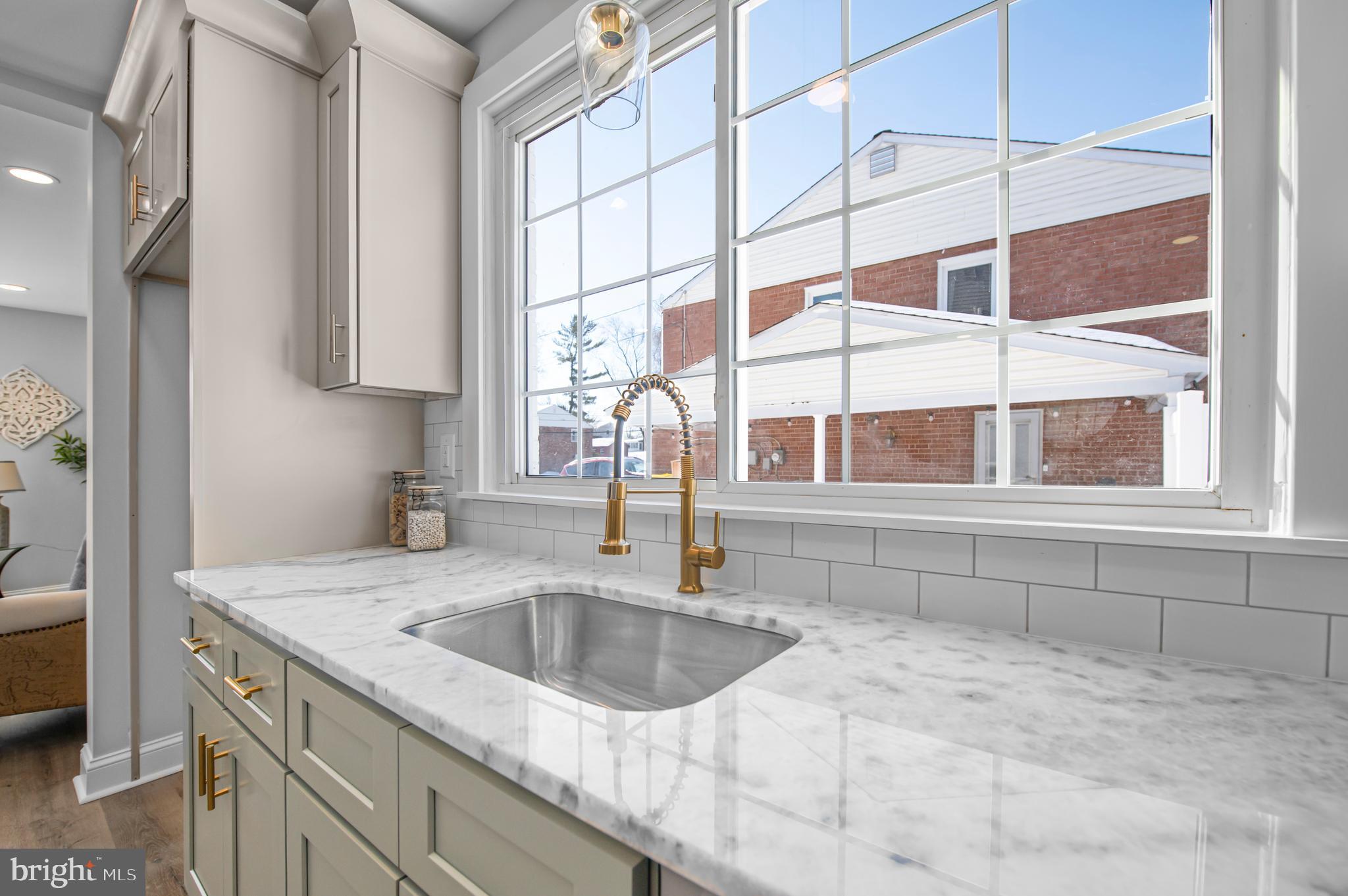 356 Abrams Mill Road King of Prussia, PA 19406 - Photo 3 of 46 a kitchen with a sink cabinets and a window