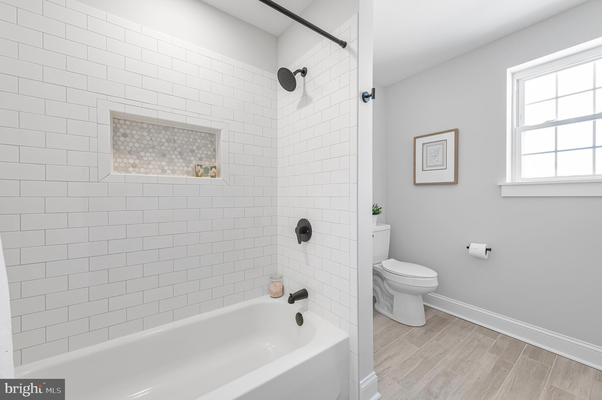 356 Abrams Mill Road King of Prussia, PA 19406 - Photo 37 of 46 a bathroom with a toilet and a bathtub