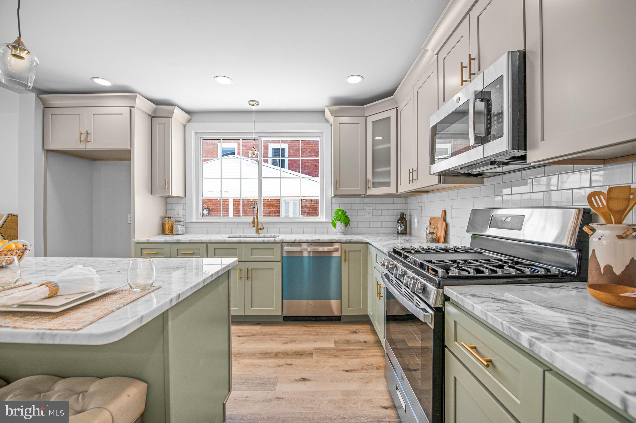 356 Abrams Mill Road King of Prussia, PA 19406 - Photo 4 of 46 a kitchen with stainless steel appliances granite countertop a sink stove and cabinets
