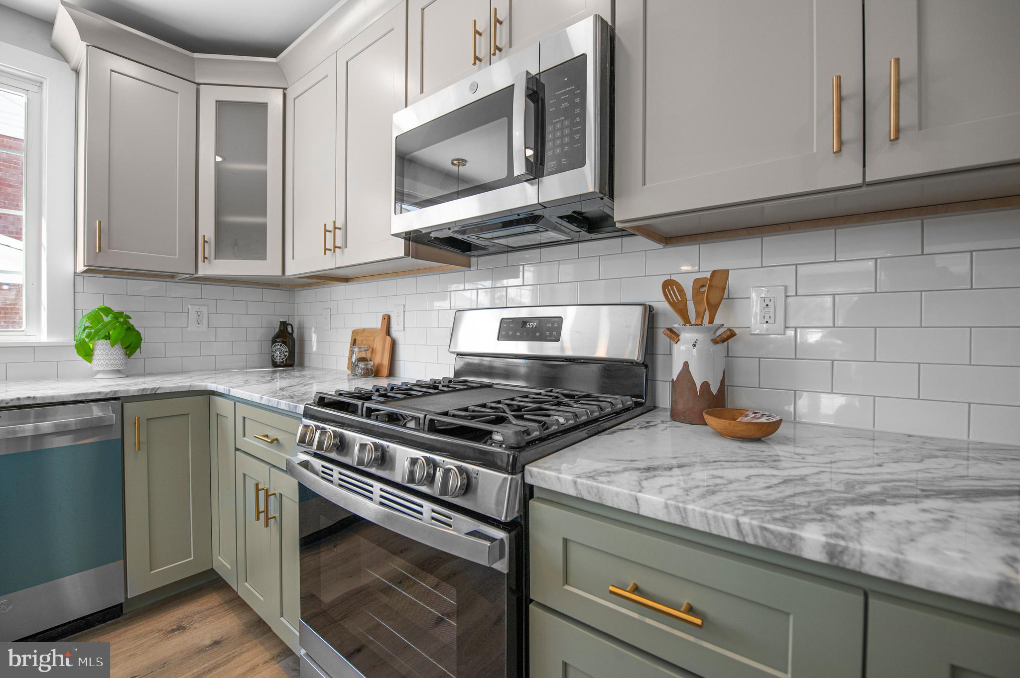 356 Abrams Mill Road King of Prussia, PA 19406 - Photo 5 of 46 a kitchen with stainless steel appliances granite countertop a sink stove and cabinets
