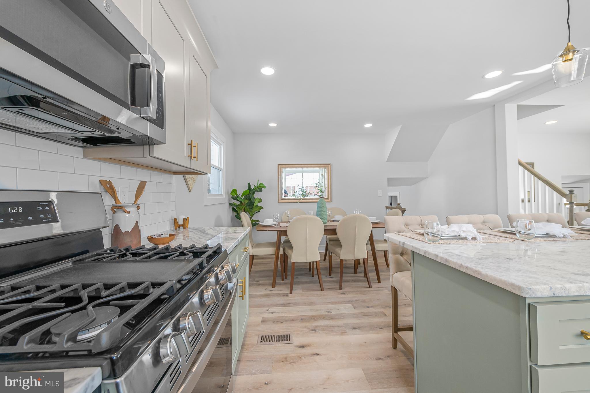 356 Abrams Mill Road King of Prussia, PA 19406 - Photo 8 of 46 a kitchen with a stove and a table