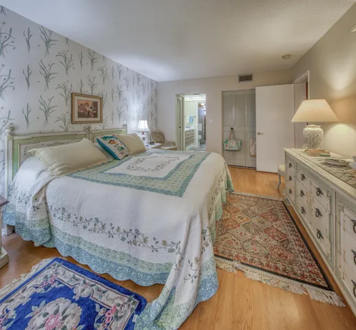 a bedroom with a bed and a table in it