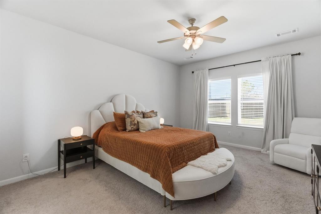 2002 Bronte Dr. Forney, TX 75126 - Photo 11 of 34 a bedroom with a bed and window