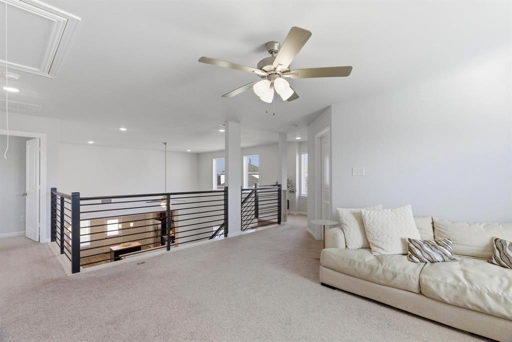 2002 Bronte Dr. Forney, TX 75126 - Photo 21 of 34 a living room with furniture and a chandelier