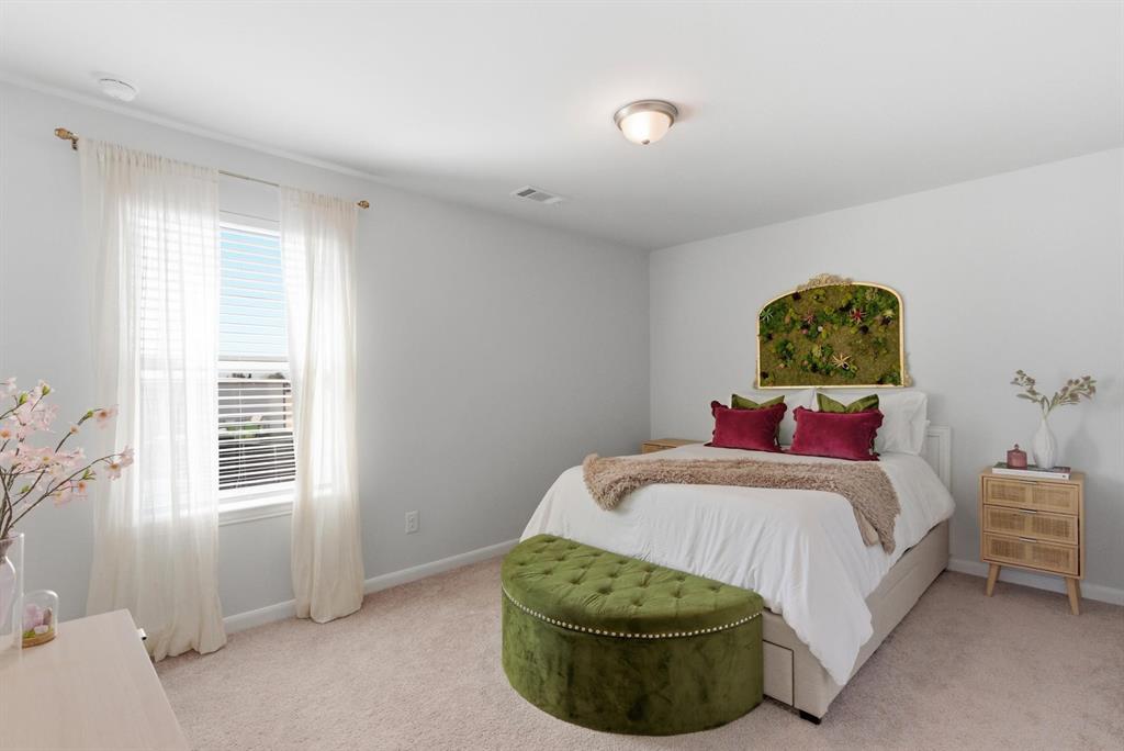 2002 Bronte Dr. Forney, TX 75126 - Photo 26 of 34 a bedroom with a bed and a window