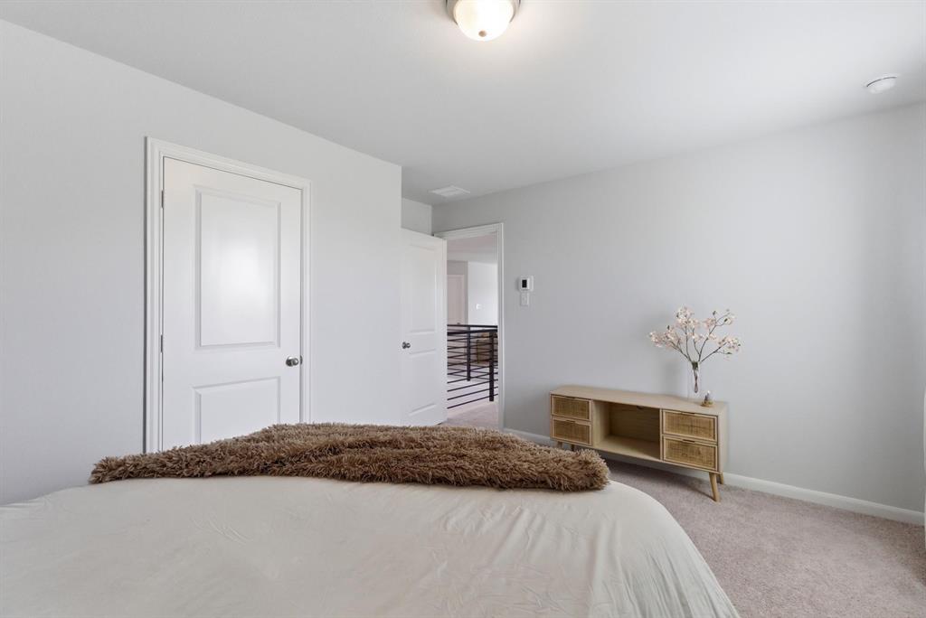 2002 Bronte Dr. Forney, TX 75126 - Photo 27 of 34 a bedroom with a bed and a window