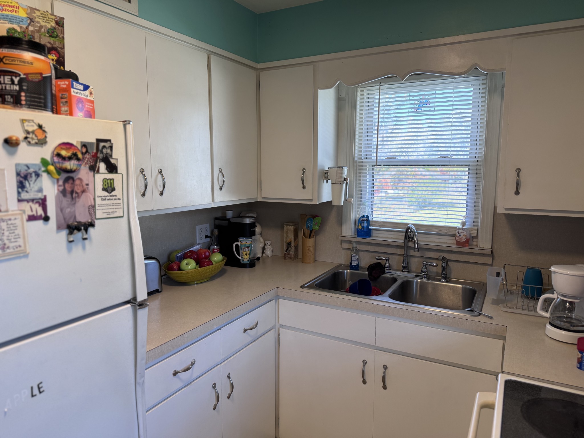 205 Draper Avenue Greenbrier, TN 37073 - Photo 11 of 27 a kitchen with a sink cabinets and window