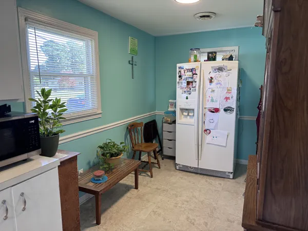 a entryway with furniture and a potted plant