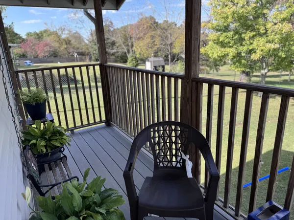 a view of a two chairs in the balcony