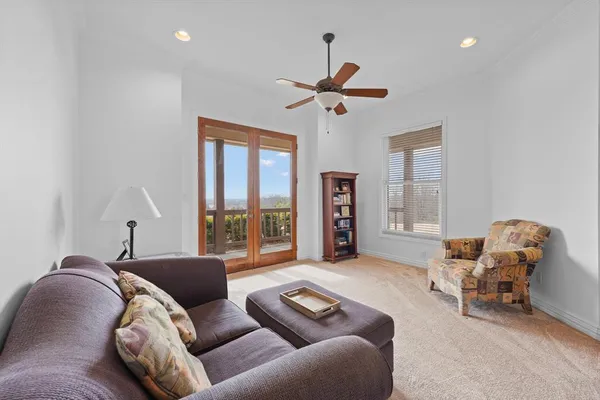 a spacious bathroom with a sink double vanity granite and a large mirror