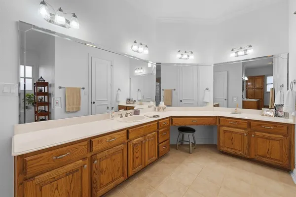 a spacious bedroom with a bed and a couch