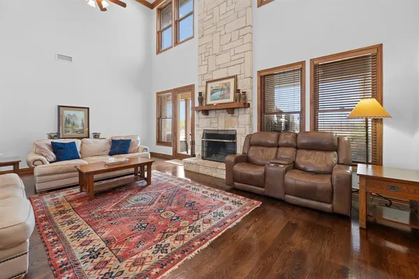 a living room with fireplace furniture and a fireplace