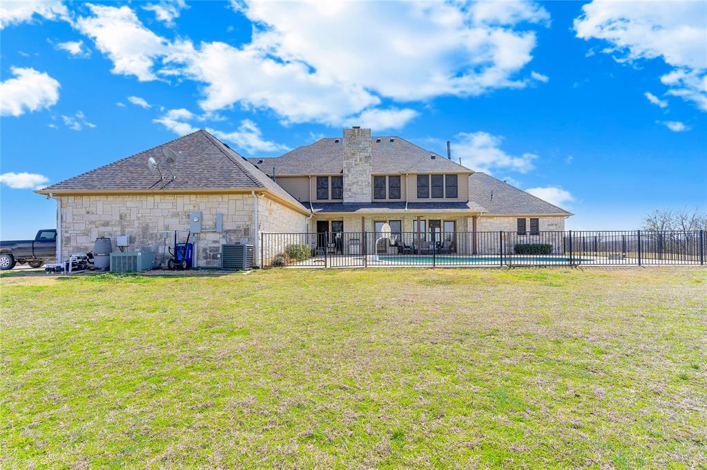 4520 South Nolan River Road Cleburne, TX 76033 - Photo 3 of 40 a front view of a house with swimming pool