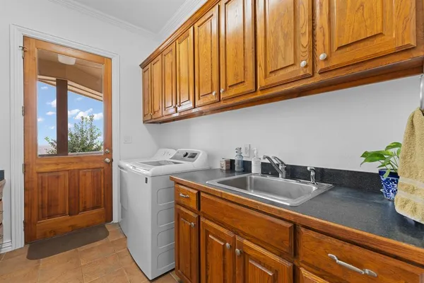 a kitchen with stainless steel appliances granite countertop a sink dishwasher stove and cabinets