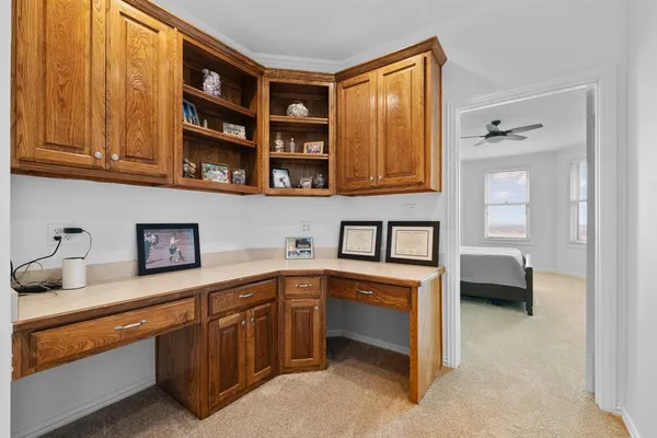 a bedroom with a bed and a television