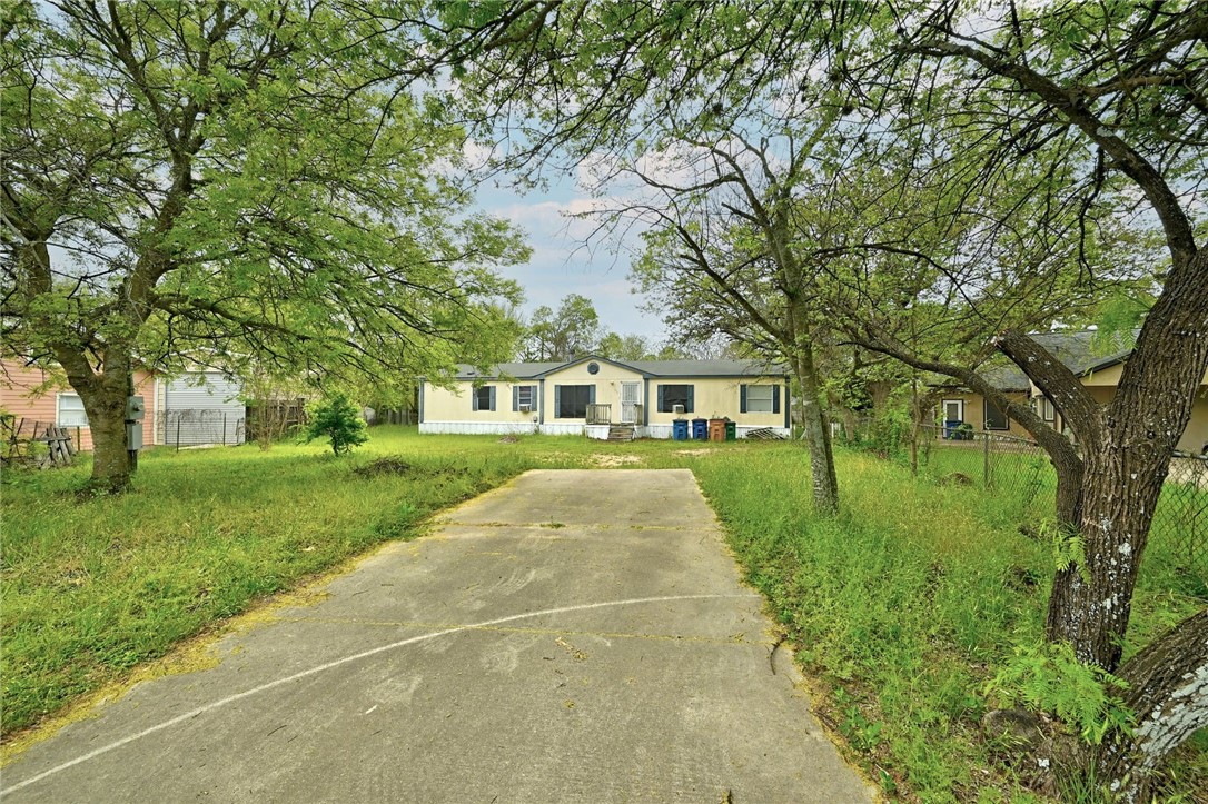 1716 Bunche Road Austin, TX 78721 - Photo 1 of 1 a front view of a house with yard and green space