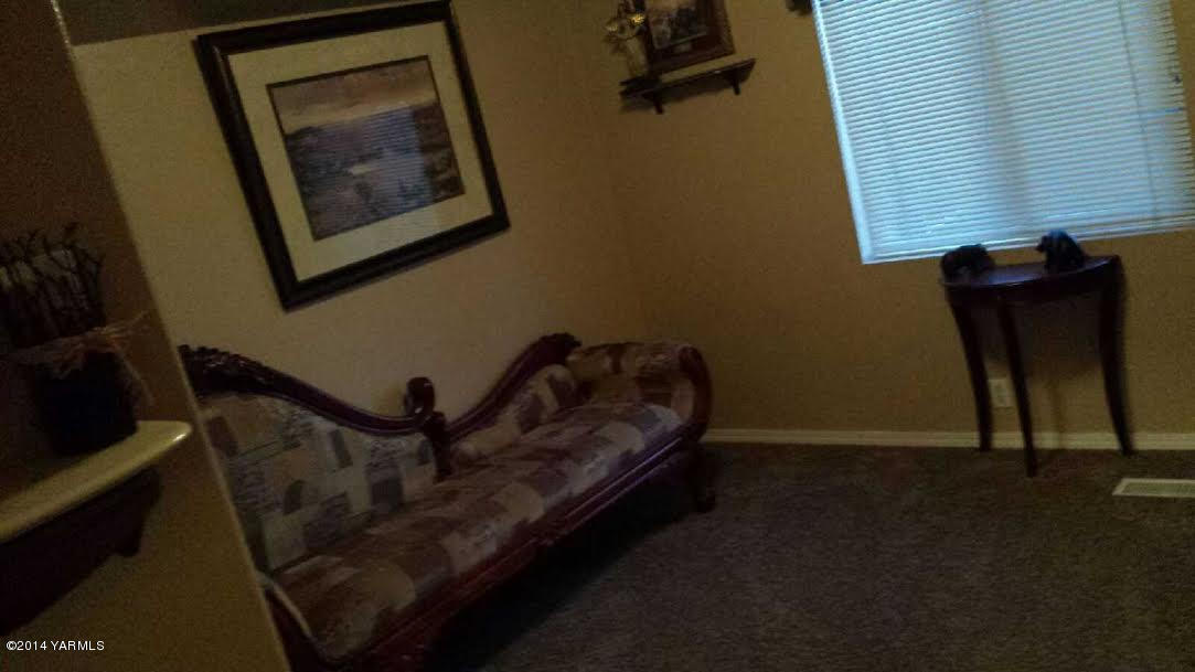 216 North Rivard Road Moxee, WA 98936 - Photo 4 of 16 a view of staircase with furniture and a potted plant