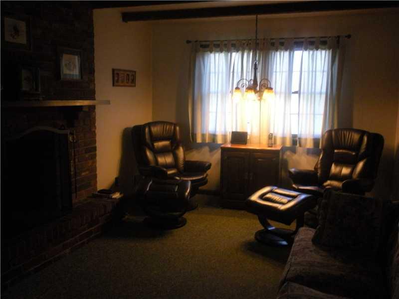 218 Ridgeview Drive Venetia, PA 15367 - Photo 7 of 16 Family Room. The family room is highlighted by a brick fireplace and beamed ceiling.