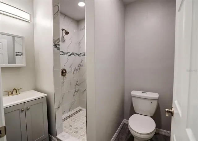 a bathroom with a toilet and a sink