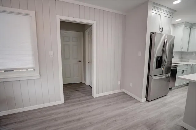 a view of hallway with wooden floor