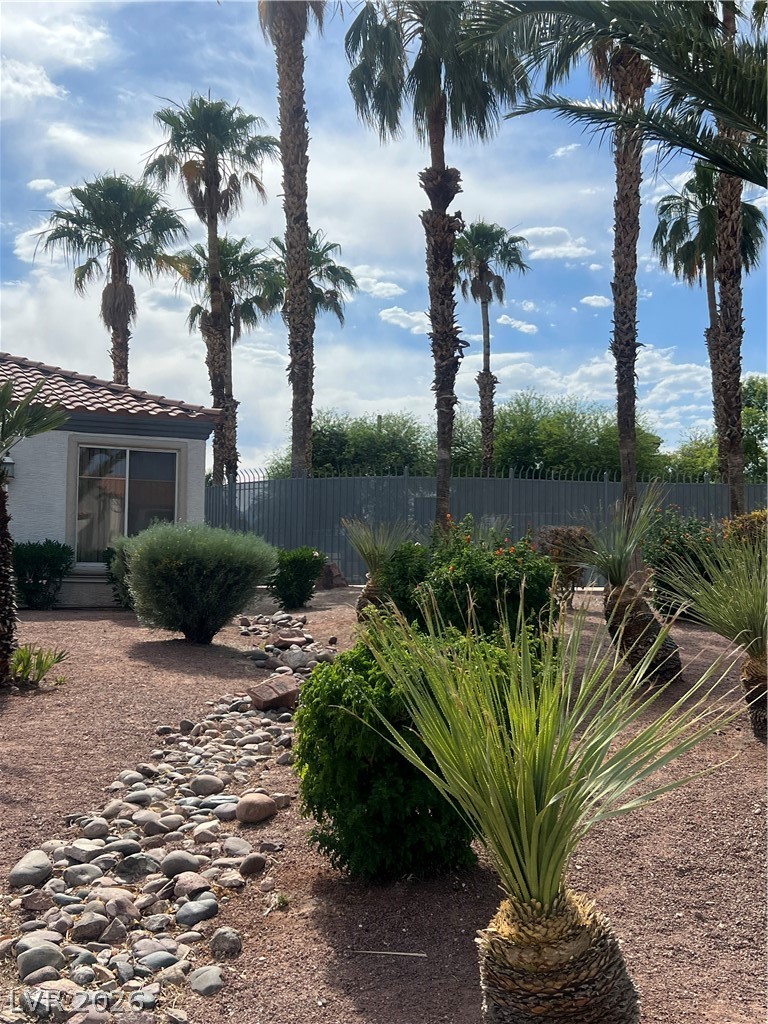 3318 North Decatur Boulevard, Unit 1174 Las Vegas, NV 89130 - Photo 22 of 23 This tranquil yard features lush landscaping, providing a serene outdoor retreat.