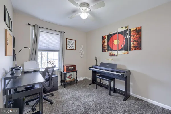 a view of a workspace with furniture