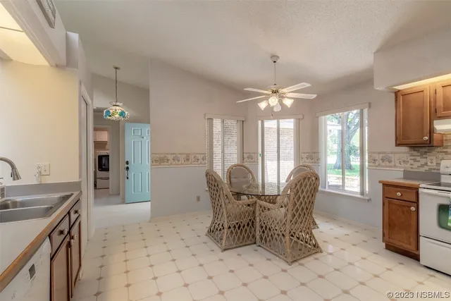 a dining room with furniture and window