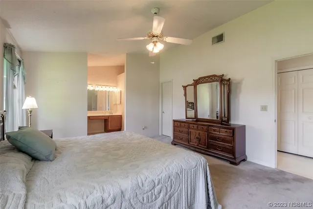 a bathroom with a double vanity sink mirror and toilet