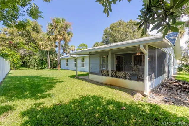 a front view of house with yard and seating area