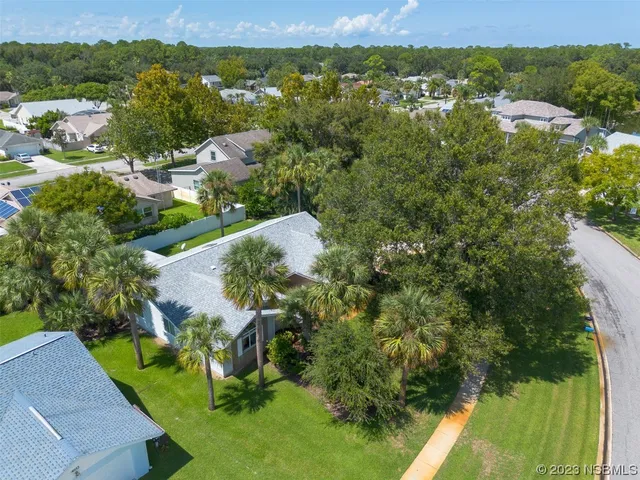 an aerial view of a house with a garden