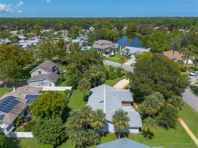 an aerial view of a house with a garden