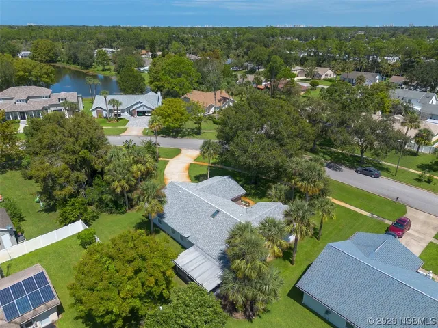 an aerial view of a house with a garden