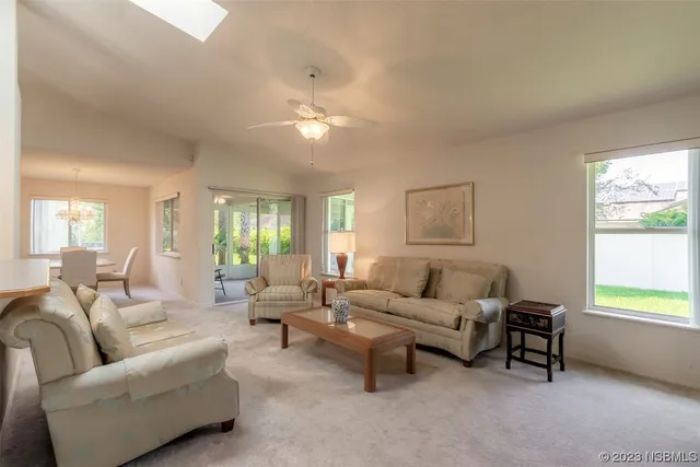 a living room with furniture and a window
