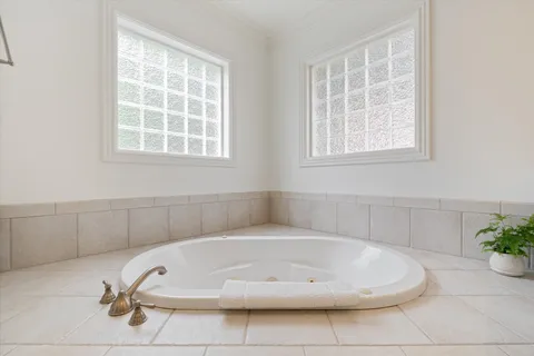 a utility room with cabinets washer and dryer