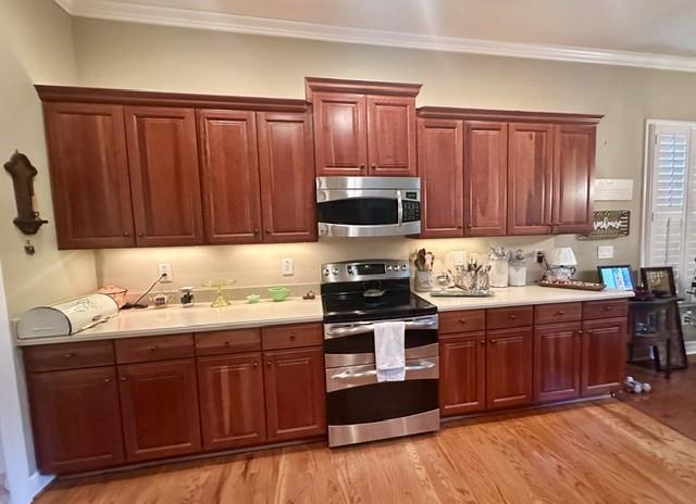 104 Willow Overlook Canton, GA 30115 - Photo 5 of 27 a kitchen with stainless steel appliances granite countertop wooden cabinets a stove top oven with wooden floor