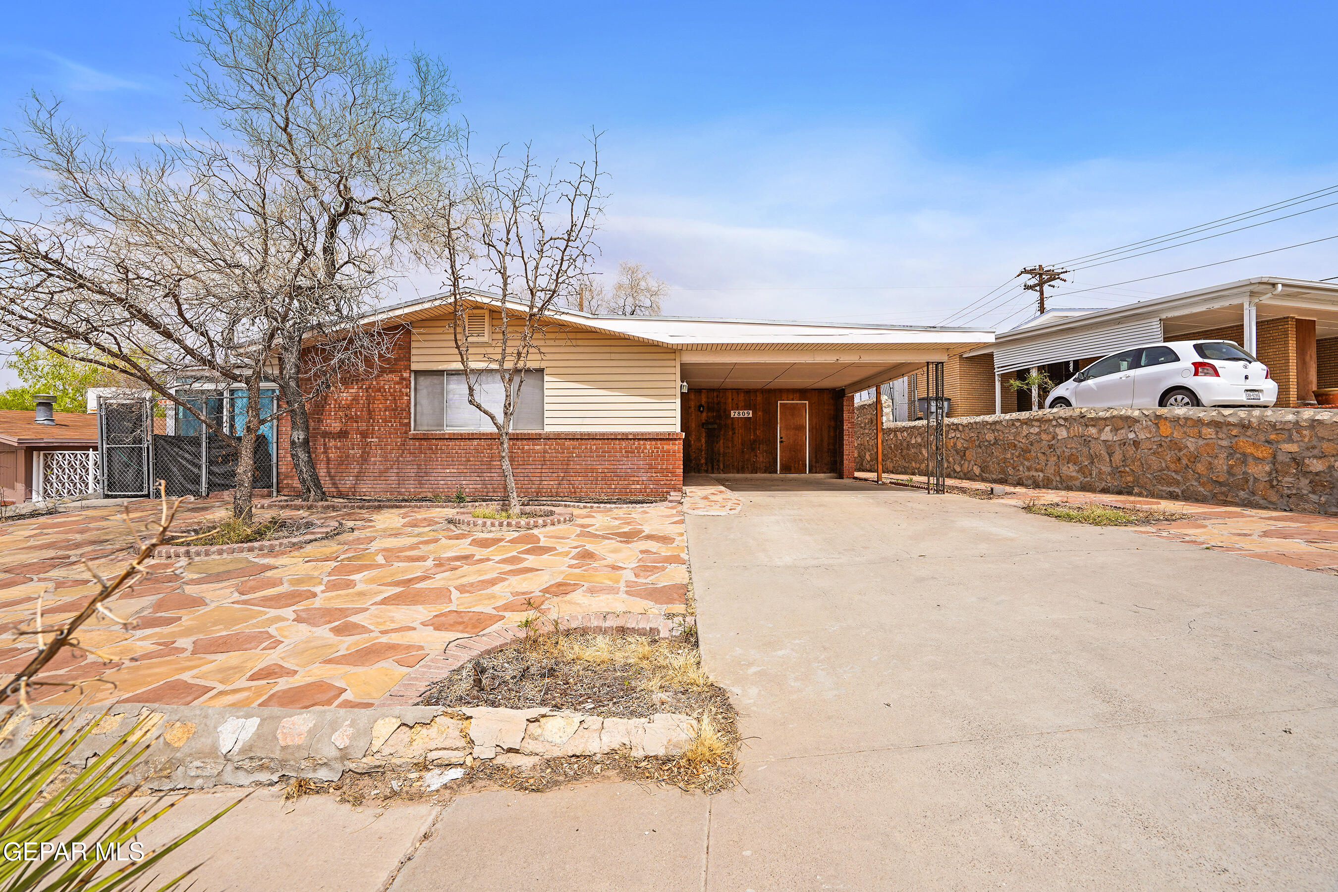 7809 Hemlock Street El Paso, TX 79925 - Photo 1 of 32 a front view of a house with a yard