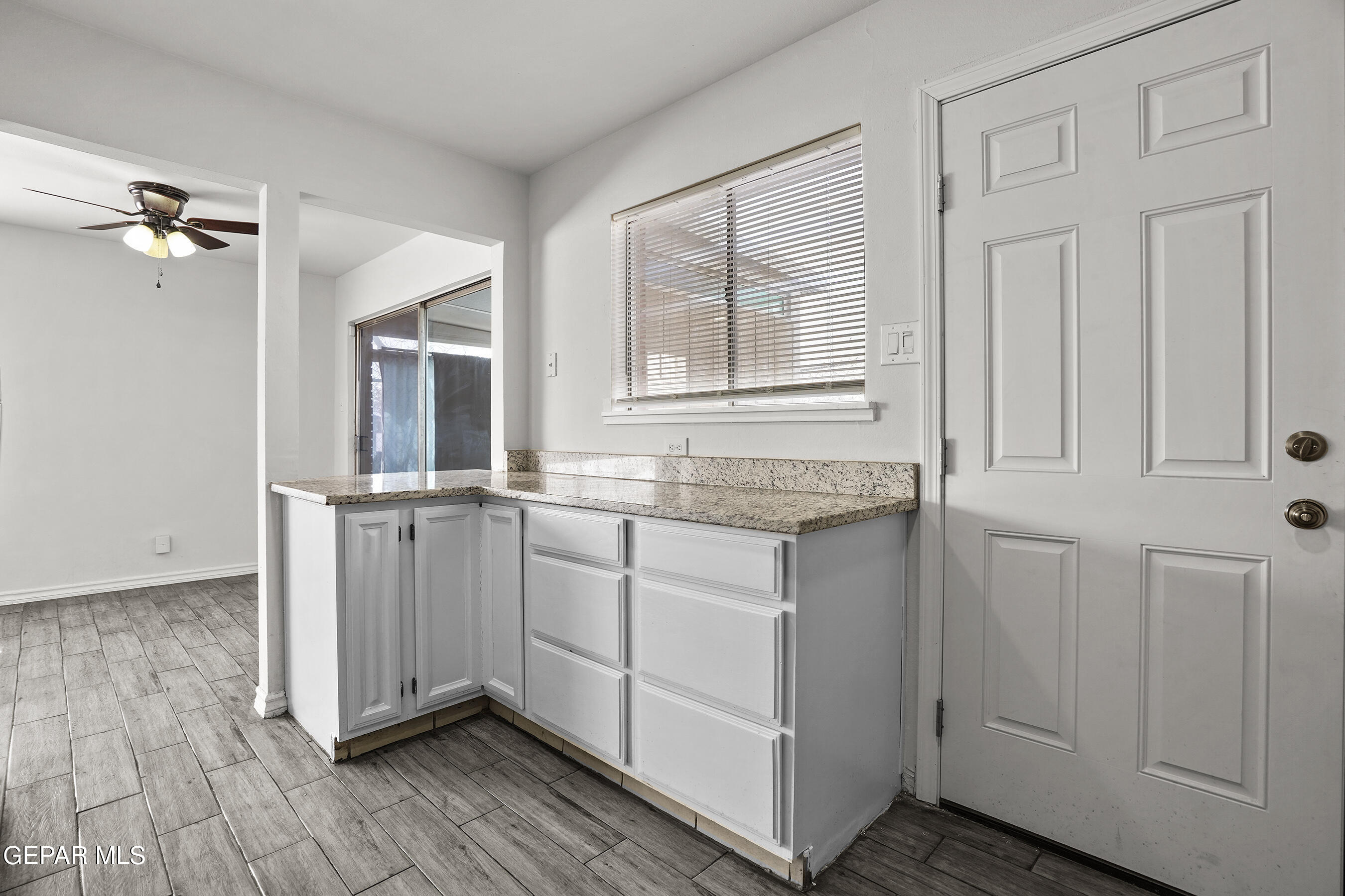 7809 Hemlock Street El Paso, TX 79925 - Photo 13 of 32 a view of kitchen with granite countertop cabinets and sink