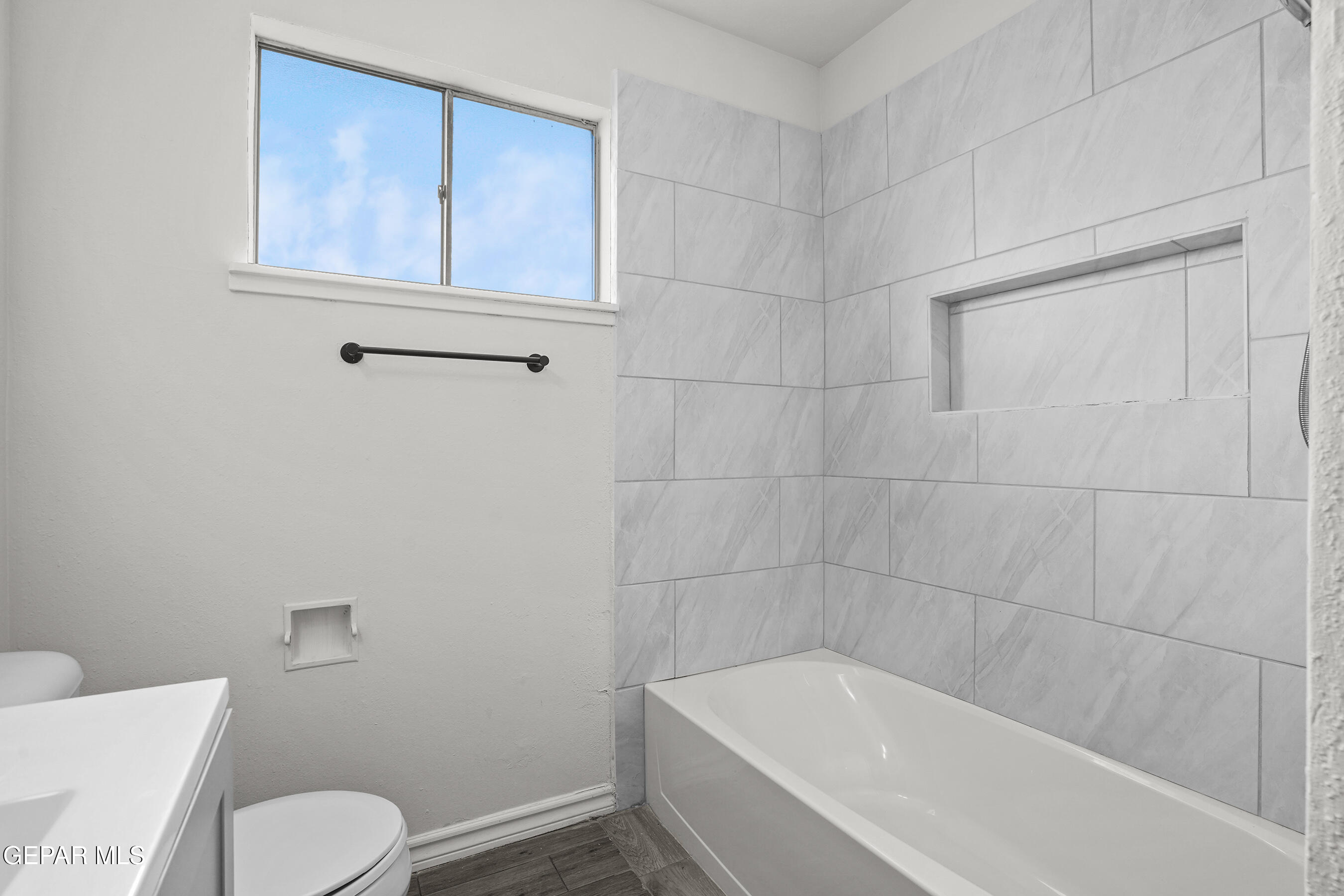 7809 Hemlock Street El Paso, TX 79925 - Photo 17 of 32 a white bath tub sitting next to a toilet