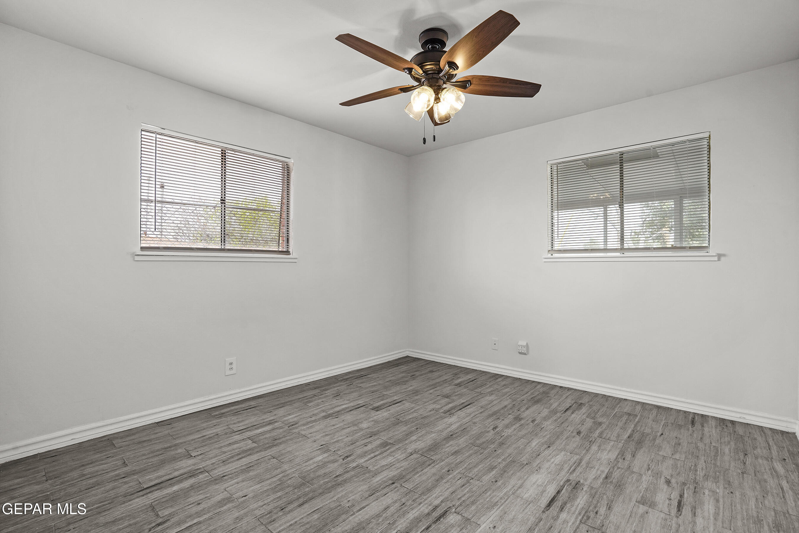 7809 Hemlock Street El Paso, TX 79925 - Photo 18 of 32 a view of empty room with wooden floor