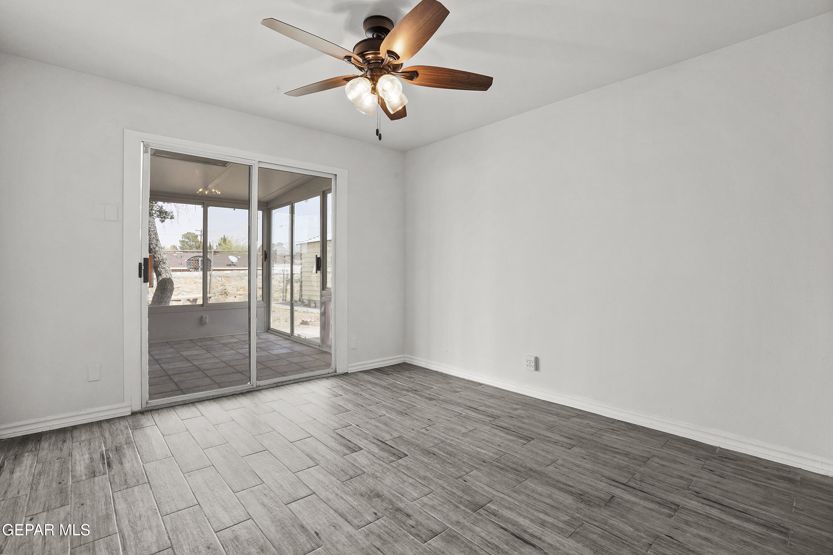 7809 Hemlock Street El Paso, TX 79925 - Photo 20 of 32 wooden floor in an empty room with a window