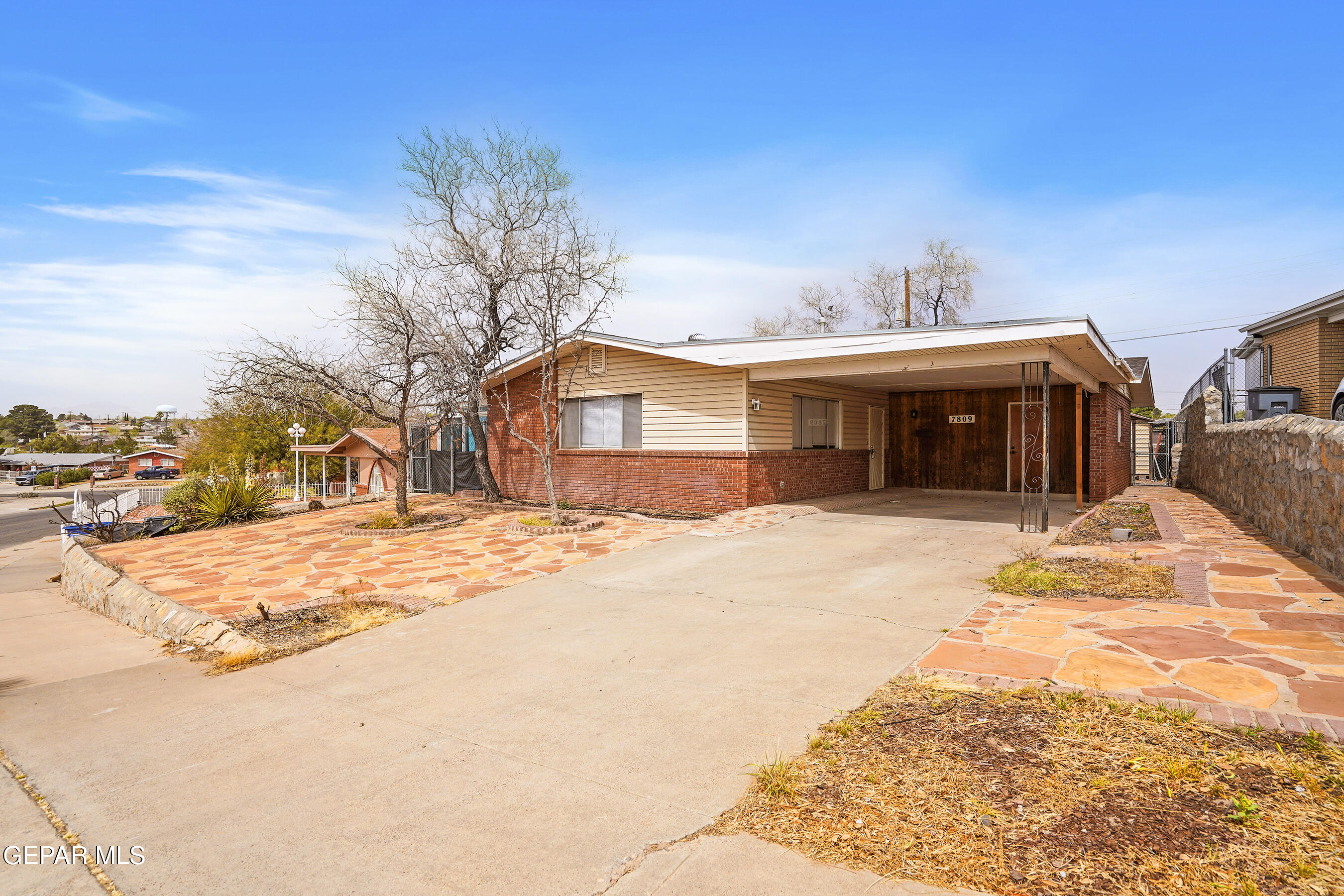 7809 Hemlock Street El Paso, TX 79925 - Photo 2 of 32 a view of a house with a snow on the road