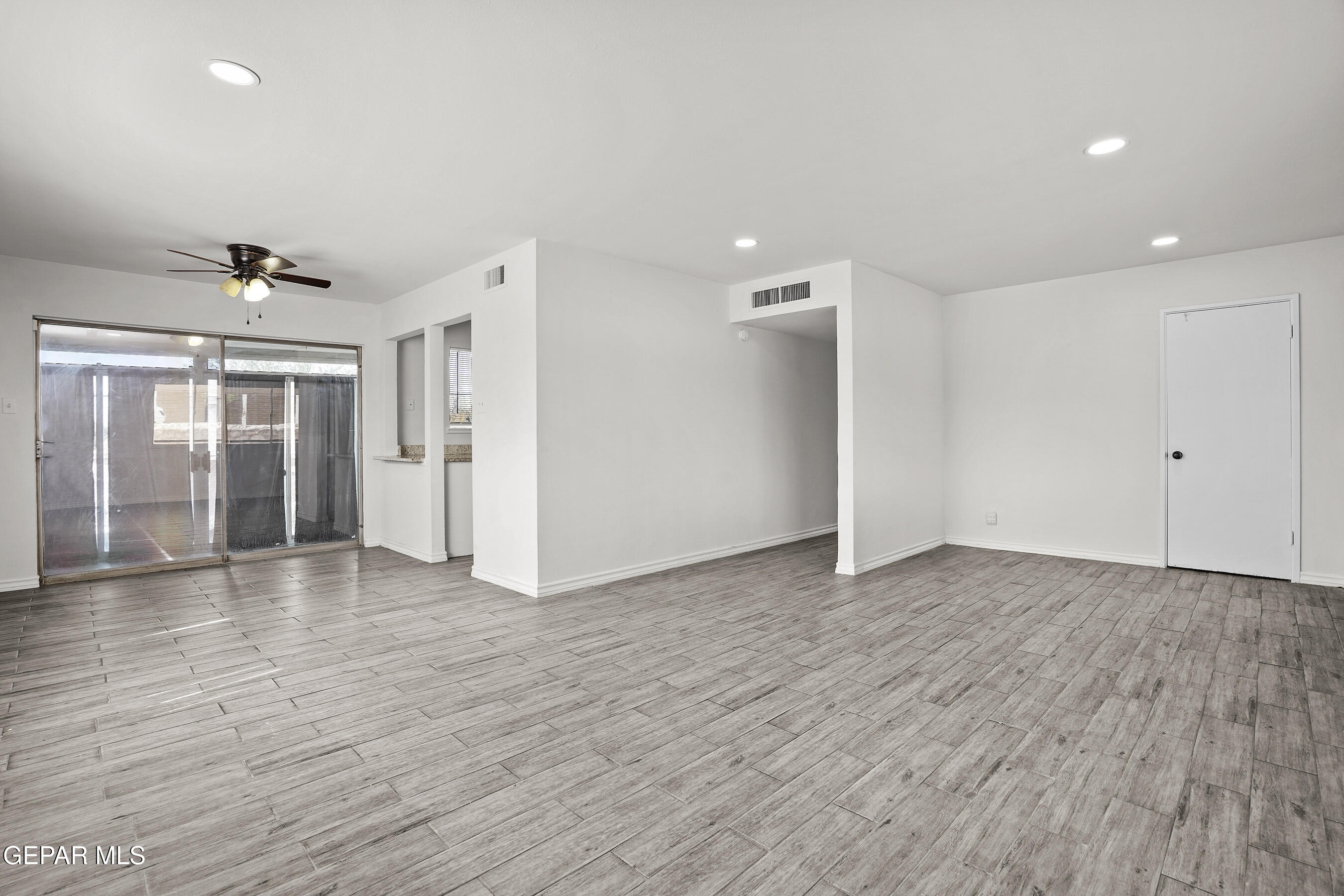 7809 Hemlock Street El Paso, TX 79925 - Photo 8 of 32 a view of empty room with wooden floor