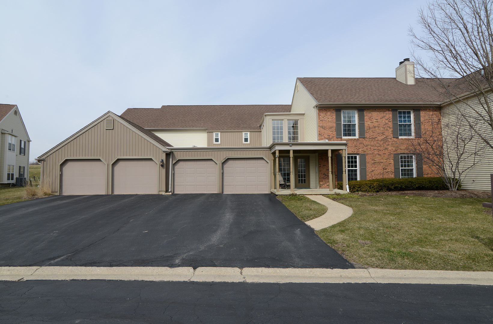 116 Dunham Place Commons, Unit 116 St. Charles, IL 60174 - Photo 1 of 26 front view of house with a yard